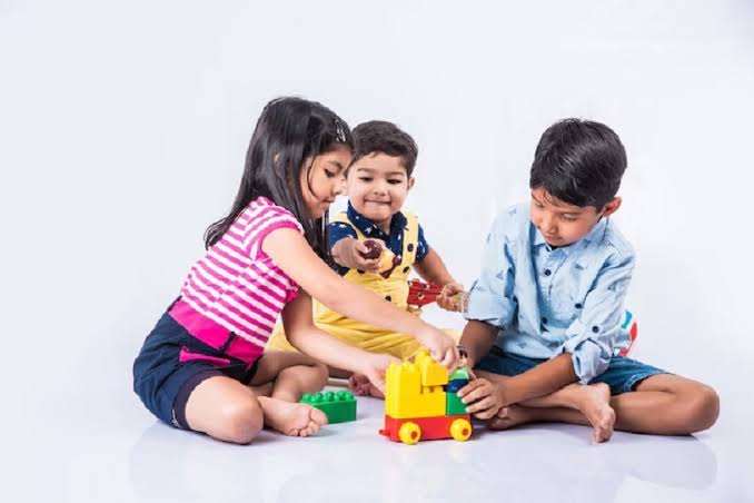 Toddler playing with blocks during a child development check in Andheri East